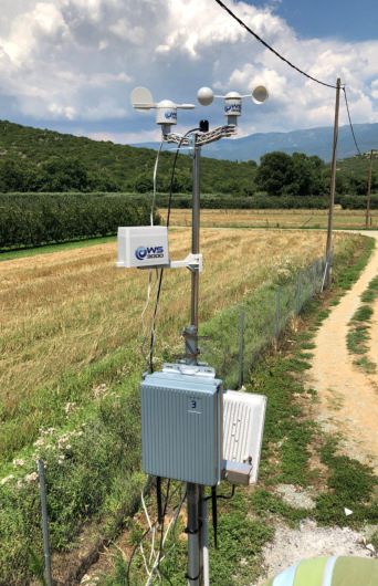 AgroNIT weather station beside a field path
