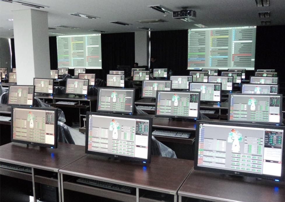 Liquid Cargo Handling Simulator classroom with trainee workstations and wall displays